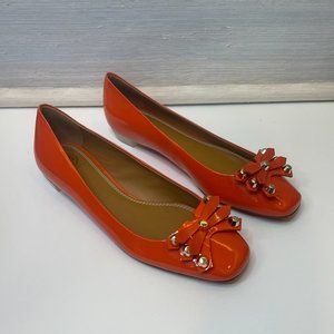 Tory Burch patent leather orange Aurora flat - studs and a lucite heel
